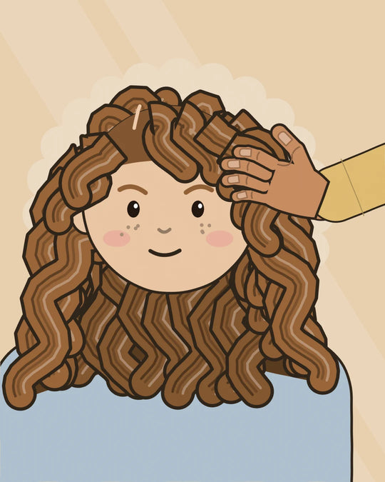 Courtney holds one section of a toddler's curls while a wide-tooth comb glides down it, and the curl below springs back into a bold spiral. The Nourish + Grow Conditioning Detangler stands beside them.
