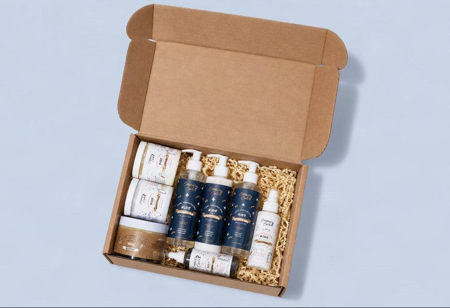 A Cristina's Curls subscription box with the bottles unpacked beside it