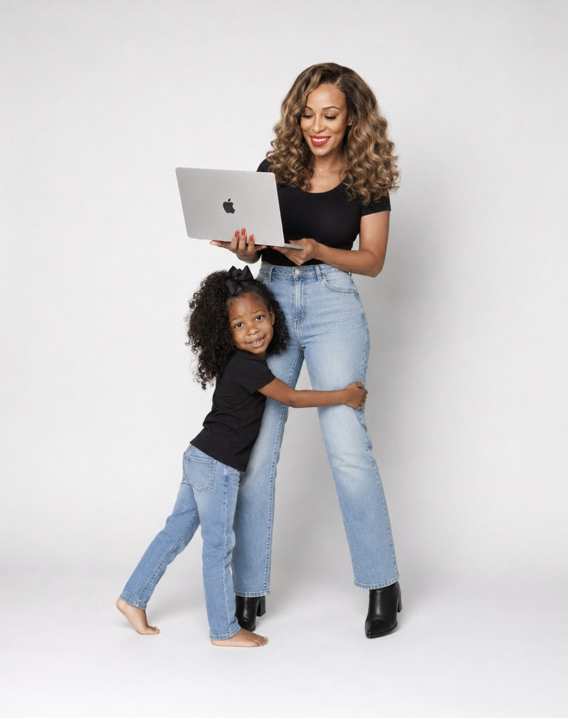 Courtney, licensed esthetician and founder, with her daughter Cristina